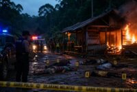 Keterangan Foto: Ilustrasi suasana lokasi kejadian pembunuhan satu keluarga di kawasan hutan Desa Benangin II, Kecamatan Teweh Timur, Barito Utara. Tampak garis polisi terpasang di sekitar area, sementara petugas melakukan olah tempat kejadian perkara di dekat pondok yang terbakar usai insiden berdarah yang menewaskan lima orang. (Ilustrasi AI)